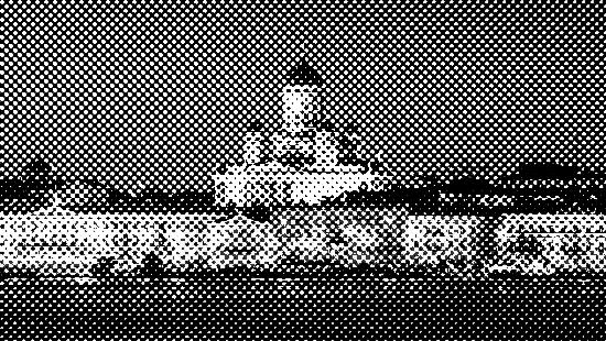 A nighttime view of Helsinki Cathedral illuminated, with the waterfront and city lights reflecting on the calm water.